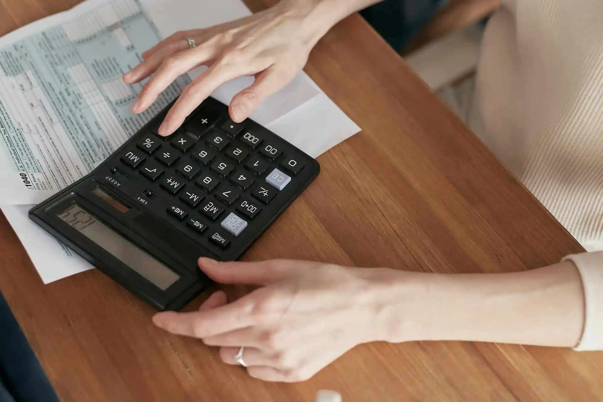 A woman calculating something on a calculator