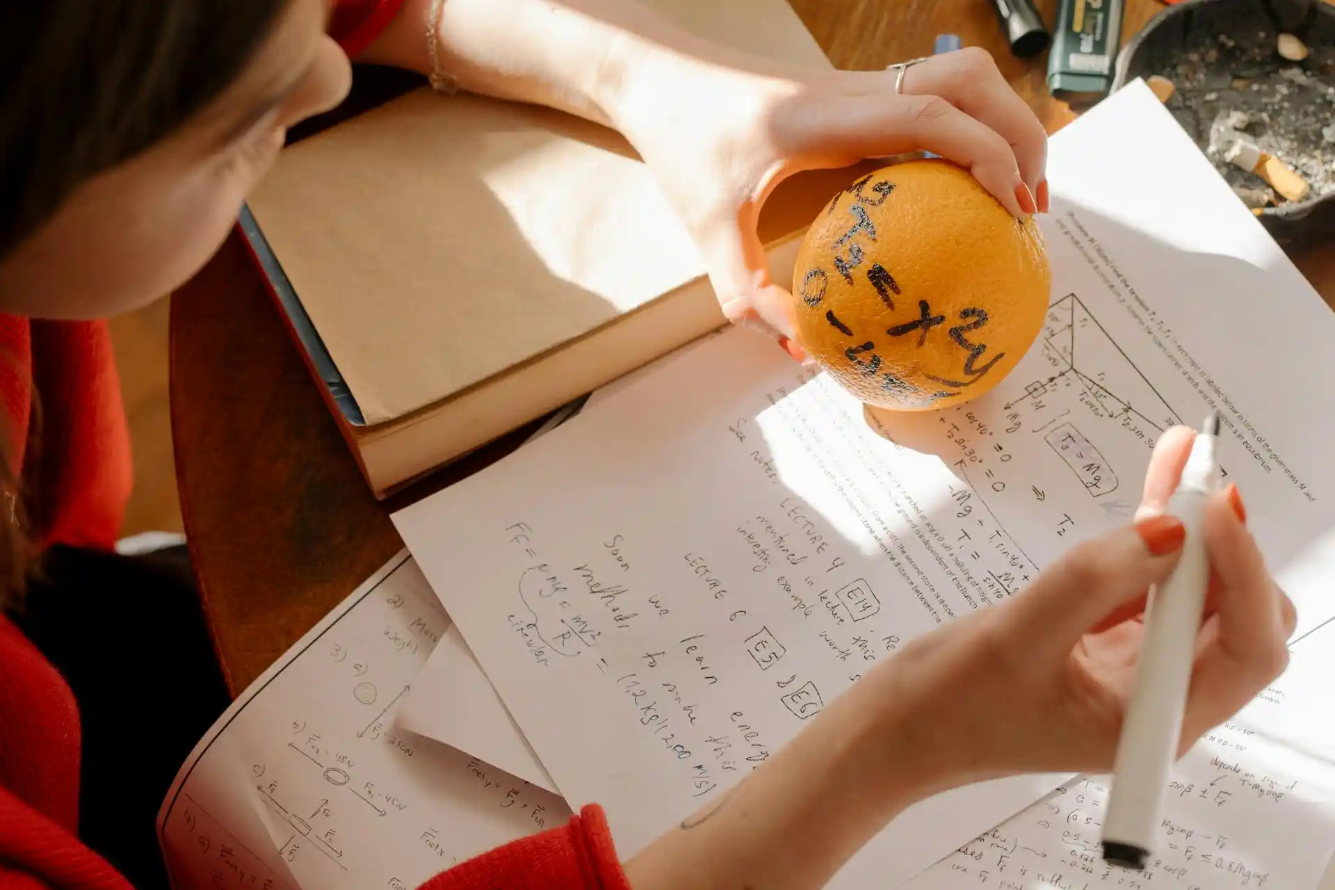 A student writing down her grades