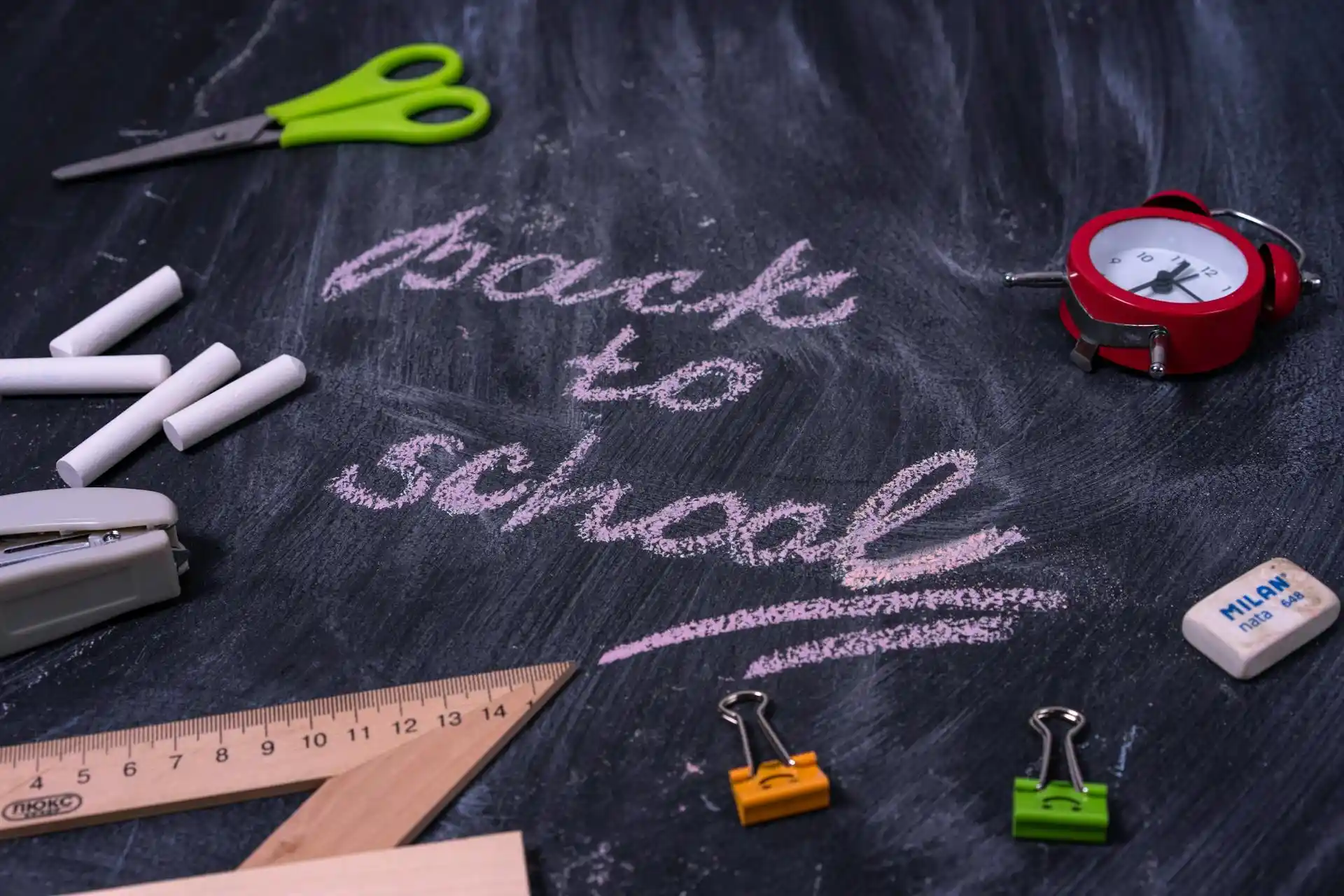 A ruler, pencils, and dusters on a table