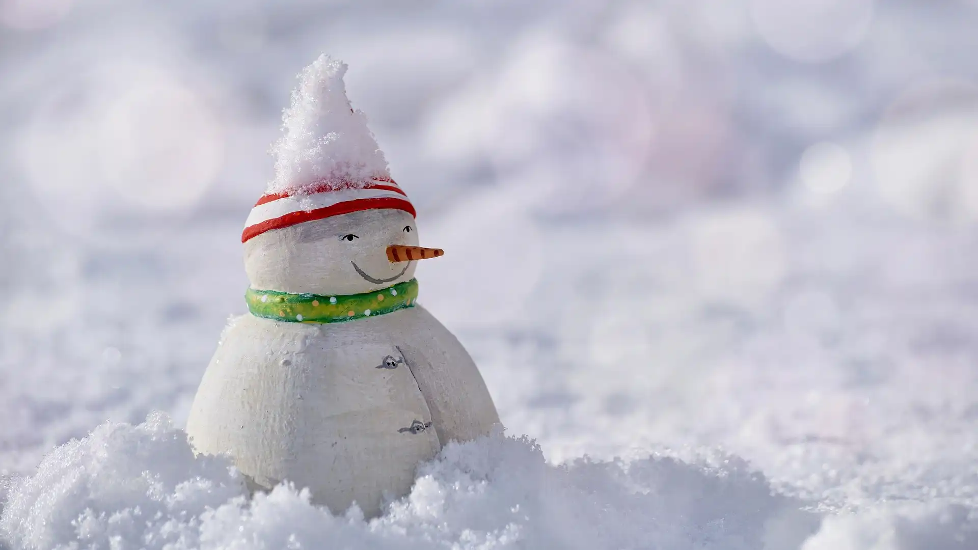 A lonely but happy snowman in the terrain